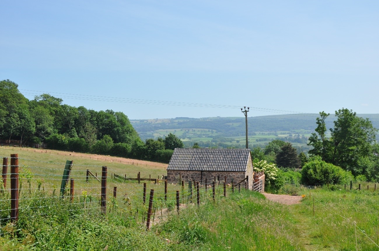 View south from Cleeve Ridge (LCA E6) towards wooded Mendip Ridge (LCA E1) within the Mendip Hills National Landscape.